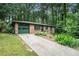 Charming brick home features a well-manicured lawn, landscaping, and an attached garage at 1094 Seville Dr, Clarkston, GA 30021