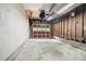Open garage with unfinished walls, exposed ceiling, and concrete flooring at 1094 Seville Dr, Clarkston, GA 30021
