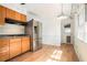 Eat-in kitchen with stainless steel appliances and large windows looking out onto the lush backyard at 1094 Seville Dr, Clarkston, GA 30021