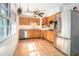 Eat-in kitchen with stainless steel appliances and large windows looking out onto the lush backyard at 1094 Seville Dr, Clarkston, GA 30021