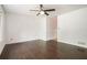 Bright room with hardwood floors, white walls, ceiling fan and lots of natural light at 1094 Seville Dr, Clarkston, GA 30021