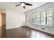 Bright room with hardwood floors, white walls, ceiling fan and lots of natural light at 1094 Seville Dr, Clarkston, GA 30021