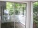Wooden balcony with screen sliding door and green scenery at 1105 Natchez Trce, Atlanta, GA 30350