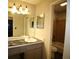 Neutral bathroom featuring marble countertops, a sink, mirror, and tiled shower/tub combo at 1105 Natchez Trce, Atlanta, GA 30350