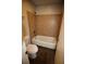 Bathroom with tiled shower/tub combo, toilet, and plank flooring at 1105 Natchez Trce, Atlanta, GA 30350