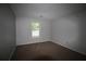 Bedroom with neutral paint, carpet, window, and electrical outlets at 1105 Natchez Trce, Atlanta, GA 30350