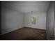Bedroom with neutral paint, carpet, window, and electrical outlets at 1105 Natchez Trce, Atlanta, GA 30350