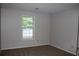 Cozy bedroom featuring neutral carpet, and a window providing natural light at 1105 Natchez Trce, Atlanta, GA 30350
