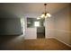 Open dining and kitchen area, featuring carpet, modern appliances, and natural light at 1105 Natchez Trce, Atlanta, GA 30350