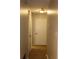A hallway featuring neutral paint and flooring, along with standard doors and lighting fixtures at 1105 Natchez Trce, Atlanta, GA 30350