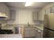 Kitchen features stainless appliances, granite countertops, and sleek cabinets at 1105 Natchez Trce, Atlanta, GA 30350