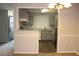 Bright kitchen features stainless appliances, granite countertops, and hardwood floors at 1105 Natchez Trce, Atlanta, GA 30350