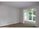 Spacious living room with neutral carpet and a view to the outside at 1105 Natchez Trce, Atlanta, GA 30350