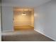 Open living room with neutral carpet and natural light at 1105 Natchez Trce, Atlanta, GA 30350