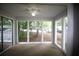 A cozy sunroom featuring natural light through many windows, offering great outdoor views at 1105 Natchez Trce, Atlanta, GA 30350