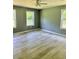 Spacious bedroom with light gray walls and beautiful light hardwood flooring at 191 Deerfield Ln, Carrollton, GA 30116