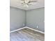 Cozy bedroom featuring modern grey walls, light-colored flooring and multiple electrical outlets at 191 Deerfield Ln, Carrollton, GA 30116
