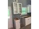 Kitchen with crisp white cabinets and an empty space for appliances to add your own touch at 191 Deerfield Ln, Carrollton, GA 30116