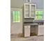 Bright kitchen with granite countertops, white cabinets, and a view to the porch at 191 Deerfield Ln, Carrollton, GA 30116