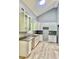 Modern kitchen with white cabinets, granite countertops, and stainless steel appliances at 191 Deerfield Ln, Carrollton, GA 30116