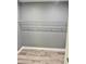 This spacious walk-in closet features sturdy shelving for convenient storage at 191 Deerfield Ln, Carrollton, GA 30116