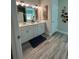 Bathroom with double sinks, white cabinets and drawers, and a stylish vanity at 3006 Fairway Dr, Villa Rica, GA 30180