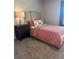 Well-lit bedroom with carpet flooring and an ornate bedside table at 3006 Fairway Dr, Villa Rica, GA 30180