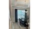 Elegant dining room featuring modern chandelier, large windows, and stylish wood flooring at 3006 Fairway Dr, Villa Rica, GA 30180