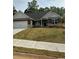 Charming brick home with a well-manicured front yard and attached two-car garage at 3006 Fairway Dr, Villa Rica, GA 30180