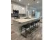 Modern kitchen with stainless appliances, sleek countertops, and barstool seating at the island at 3006 Fairway Dr, Villa Rica, GA 30180