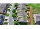 Aerial view of property in tree-lined neighborhood with fenced in backyard and lawn at 3123 Cross Creek Dr, Cumming, GA 30040