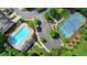 Aerial view of a community pool and tennis courts surrounded by lush landscaping and parking at 3123 Cross Creek Dr, Cumming, GA 30040