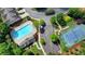 Aerial view of a community pool and tennis courts surrounded by lush landscaping and parking at 3123 Cross Creek Dr, Cumming, GA 30040