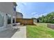 Backyard patio with green grass, wooden fence, and easy access to the house at 3123 Cross Creek Dr, Cumming, GA 30040