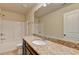Bathroom with granite countertops, a large mirror, and a shower-tub combo at 3123 Cross Creek Dr, Cumming, GA 30040