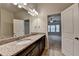Well-lit bathroom featuring double vanity, granite counters, and bathroom views at 3123 Cross Creek Dr, Cumming, GA 30040