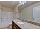 Bathroom with granite countertops, a large mirror, and a shower-tub combo at 3123 Cross Creek Dr, Cumming, GA 30040
