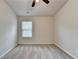 Neutral bedroom featuring a ceiling fan, natural lighting, and neutral carpeting at 3123 Cross Creek Dr, Cumming, GA 30040