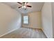 A cozy bedroom features a neutral palette, plush carpet, and a modern ceiling fan for added comfort at 3123 Cross Creek Dr, Cumming, GA 30040