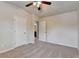 Bedroom featuring neutral walls, plush carpet, a ceiling fan, and ensuite bath access at 3123 Cross Creek Dr, Cumming, GA 30040