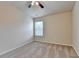 Bedroom featuring plush carpet, a ceiling fan, and a window for natural light at 3123 Cross Creek Dr, Cumming, GA 30040