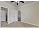A carpeted bedroom featuring a closet and two doors that provides multiple access points at 3123 Cross Creek Dr, Cumming, GA 30040
