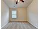 An inviting carpeted bedroom with a ceiling fan and a window at 3123 Cross Creek Dr, Cumming, GA 30040