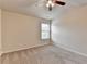 An inviting bedroom featuring a cozy atmosphere, plush carpeting, and a modern ceiling fan for comfort at 3123 Cross Creek Dr, Cumming, GA 30040