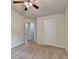 A carpeted bedroom featuring a ceiling fan and a window that provides natural light at 3123 Cross Creek Dr, Cumming, GA 30040