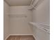 Walk-in closet equipped with wire shelving offers ample storage in this thoughtfully designed home at 3123 Cross Creek Dr, Cumming, GA 30040
