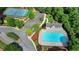 Aerial view of a pristine community pool surrounded by lush landscaping and community amenities at 3123 Cross Creek Dr, Cumming, GA 30040