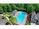 A large, refreshing community pool with ample space for relaxation and recreation, surrounded by lush greenery at 3123 Cross Creek Dr, Cumming, GA 30040