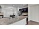 Bright kitchen featuring granite countertops, stainless steel appliances, a breakfast bar, and dark cabinetry at 3123 Cross Creek Dr, Cumming, GA 30040