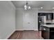 Open-concept space with stainless steel appliances, granite countertops, and dark cabinetry at 3123 Cross Creek Dr, Cumming, GA 30040